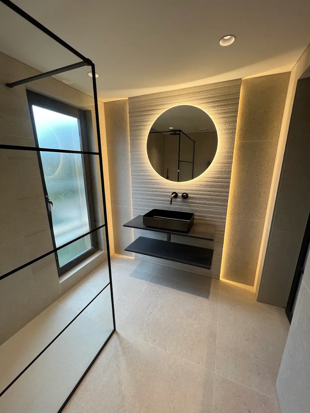 Newly fitted bathroom with tiled walls